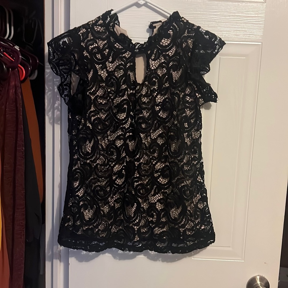 A beautiful black top by PerSeption Concept